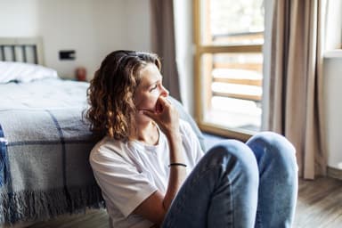Woman is upset about her financial situation.