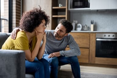 Couple discusses debt.