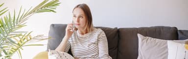 A woman dealing with debt collectors want to know How to Get Debt Collectors to Stop Calling