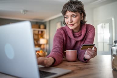 Woman checks out of her credit card balance.