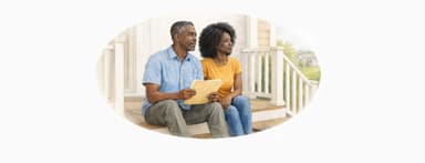 Couple on front porch looking at papers