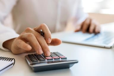 Person uses a calculator.